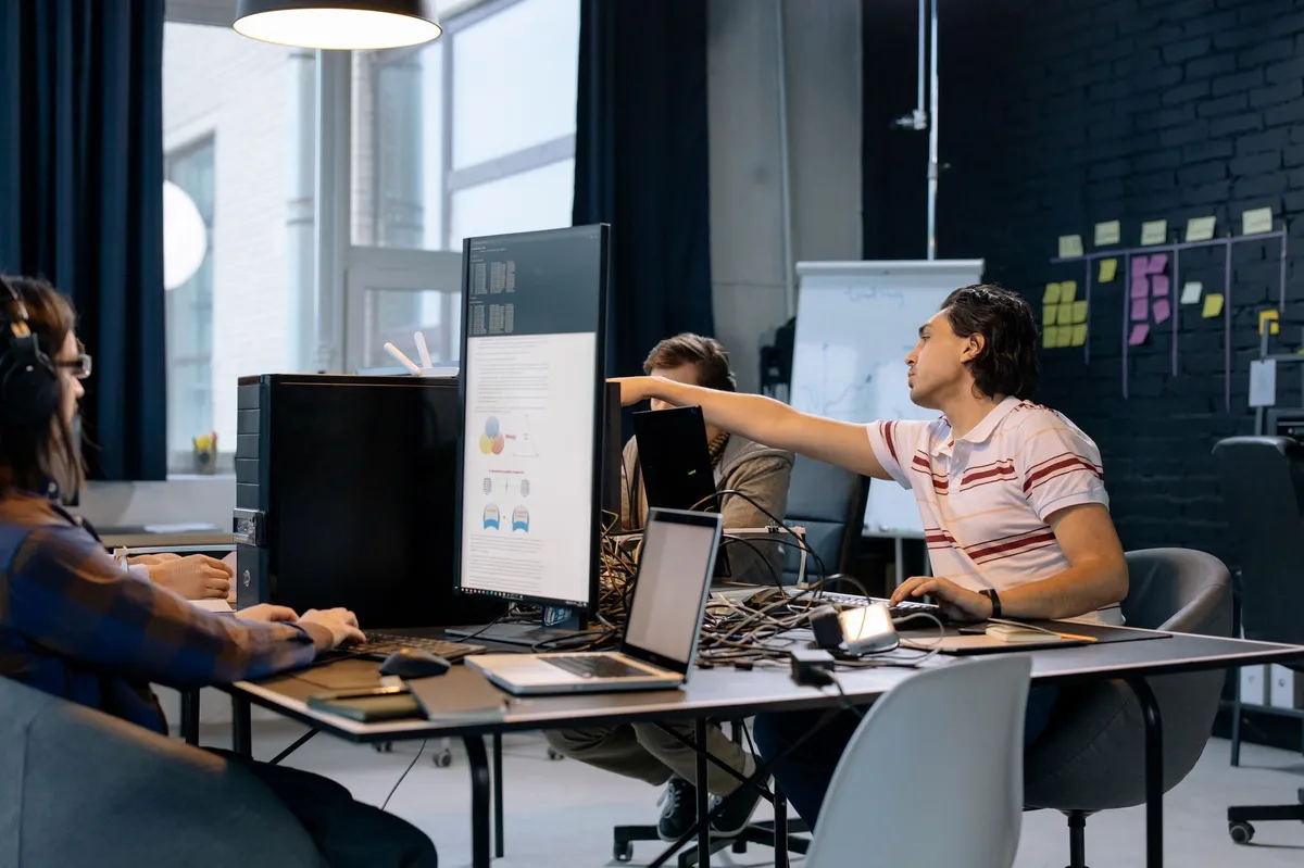tech employees working together