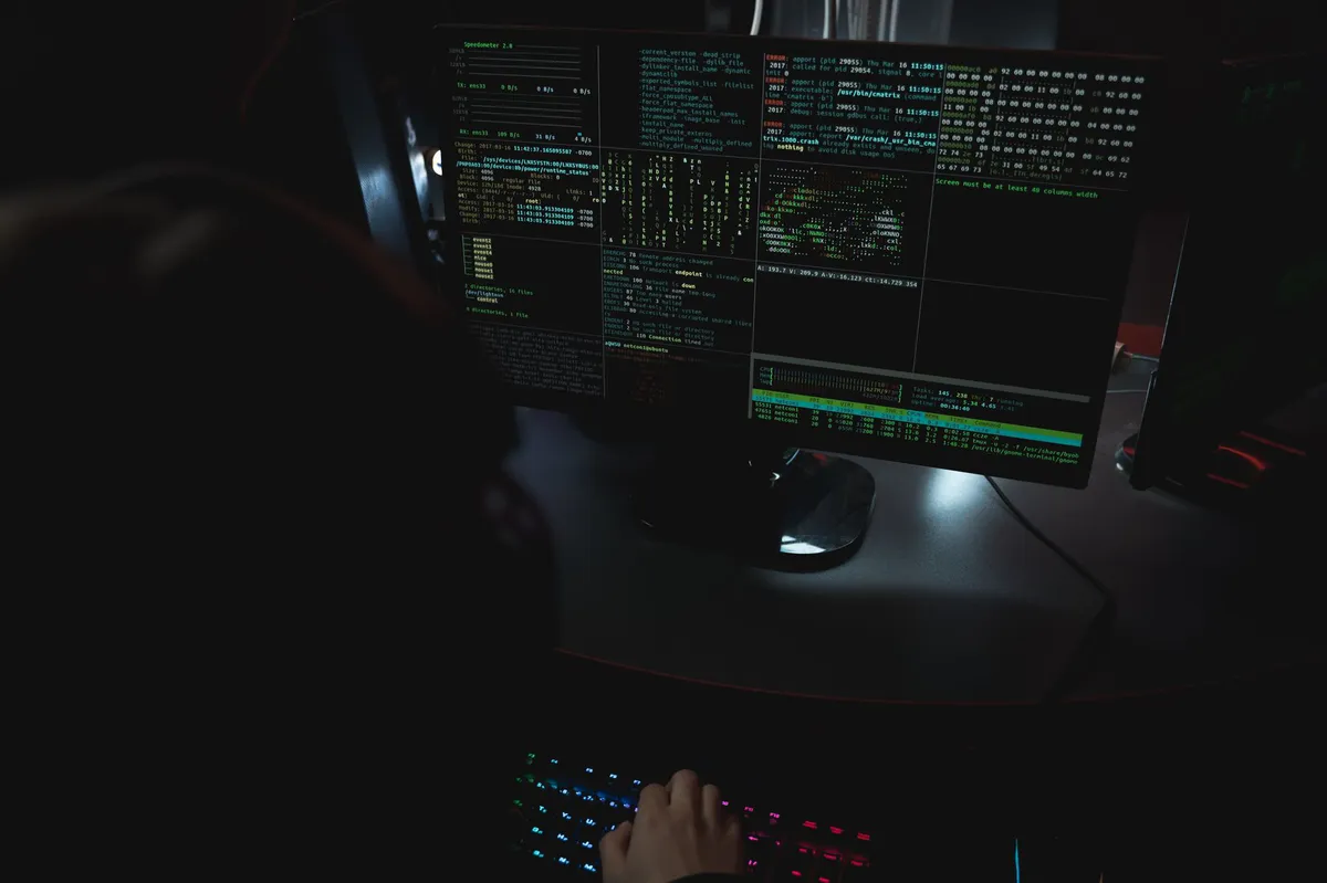 cybersecurity hacker in dark room