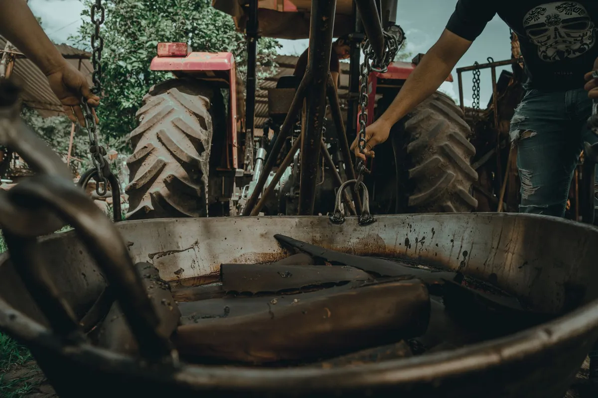 farmer fixing tractor