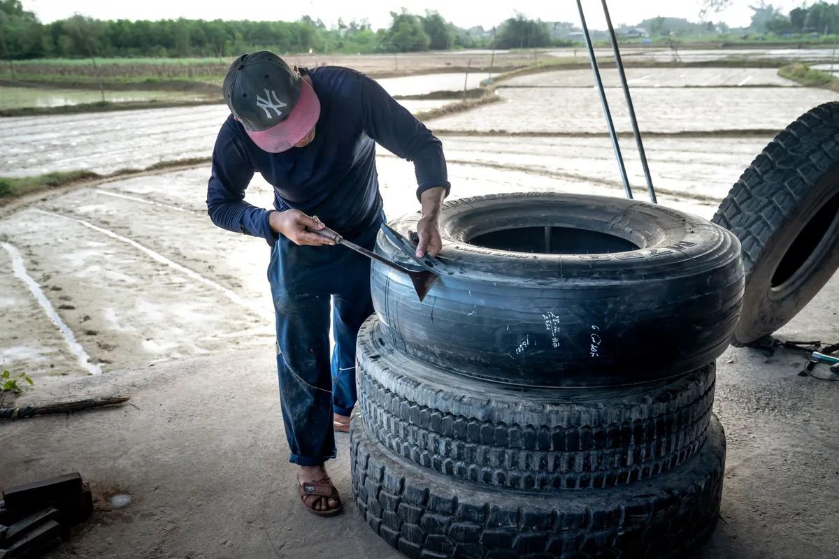 happy farmer with repaired equipment