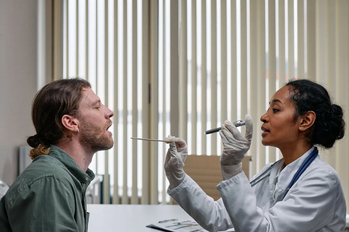 doctor examining patient