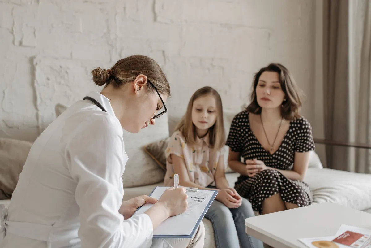 pediatrician consulting with a parent