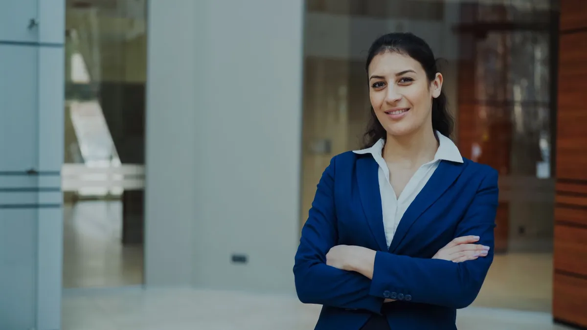 woman in business suit smiling