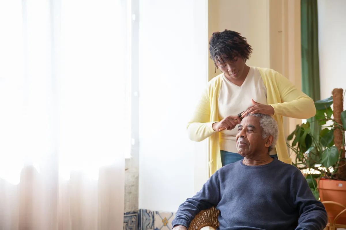 elderly man with caregiver