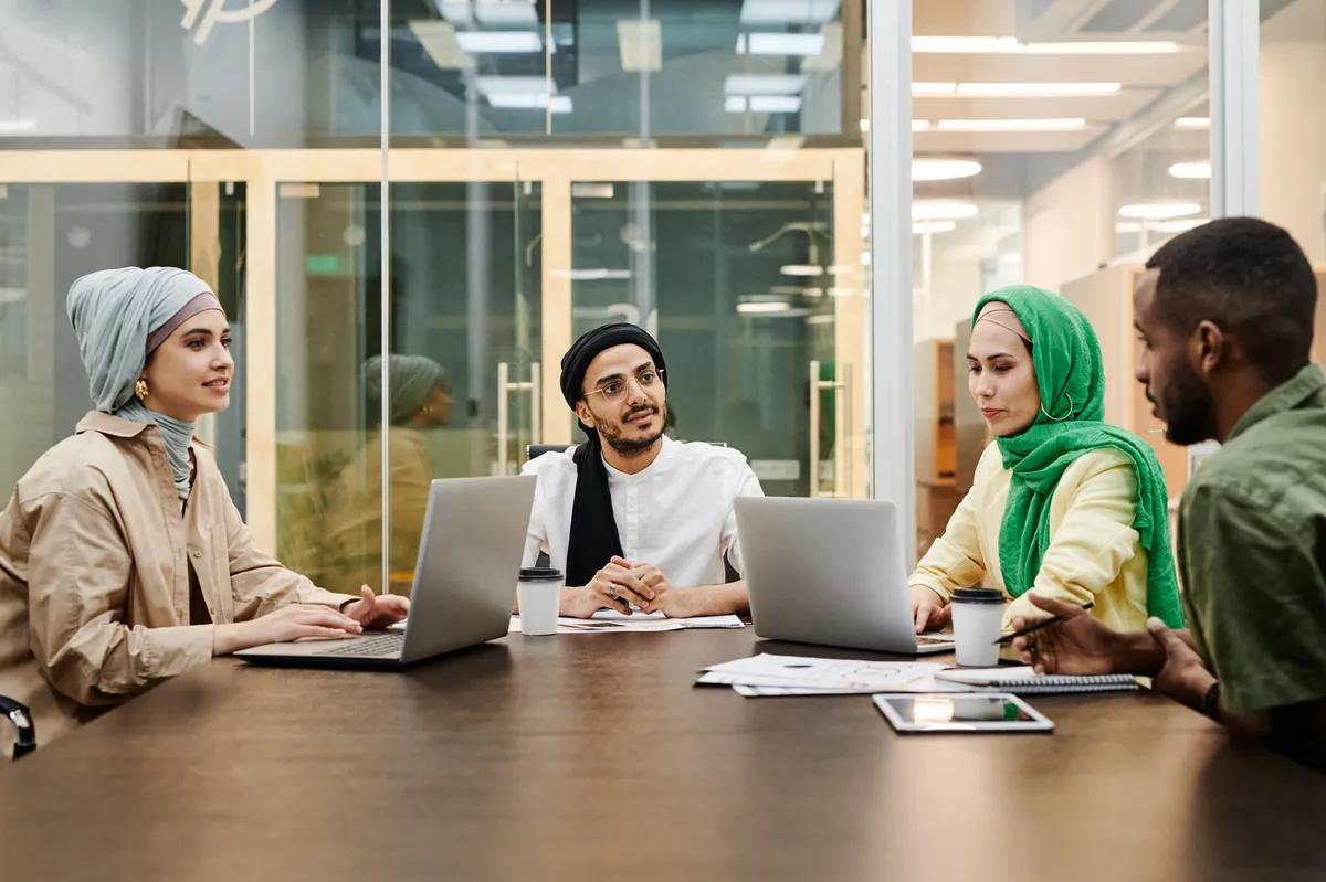 diverse newsroom meeting