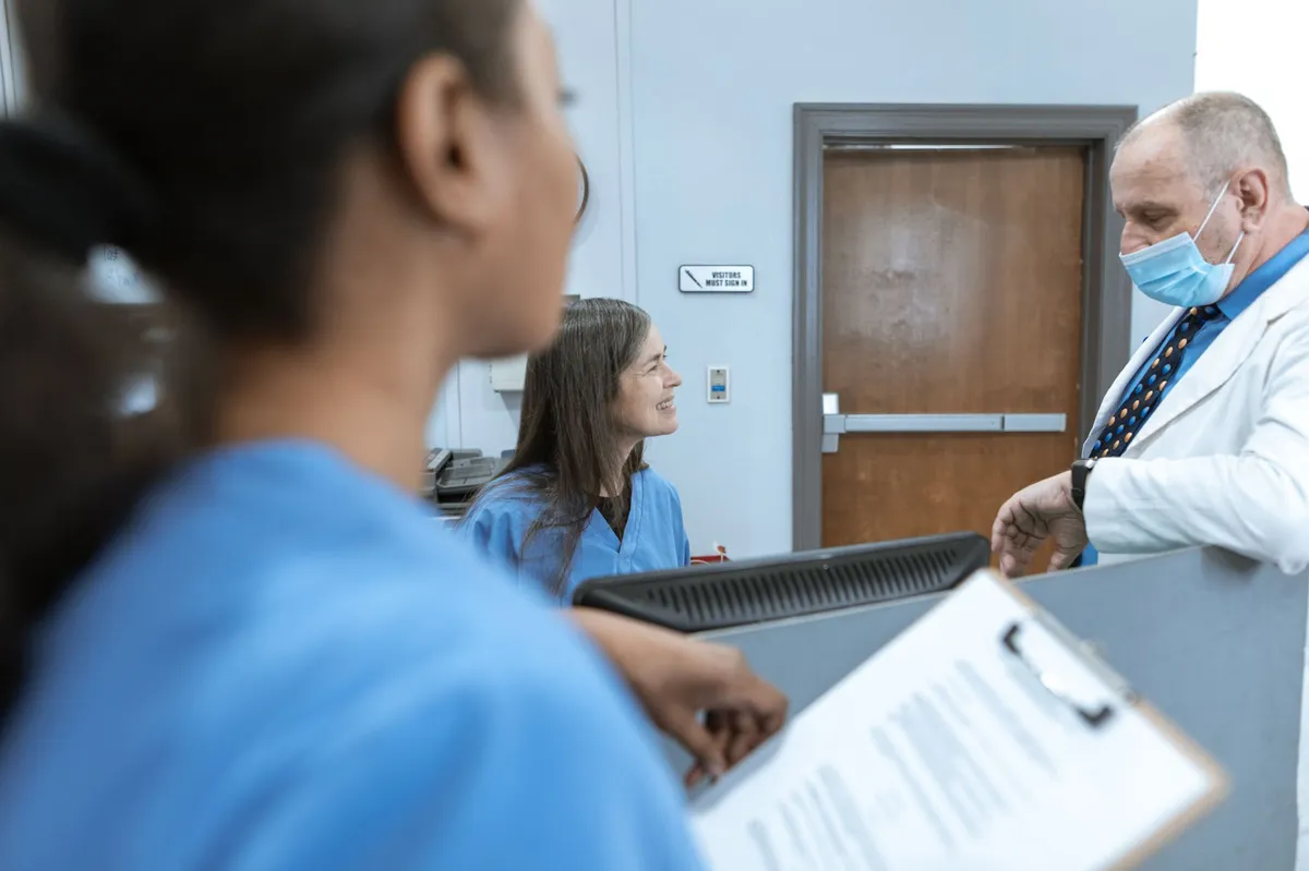 hospital staff discussing patient care