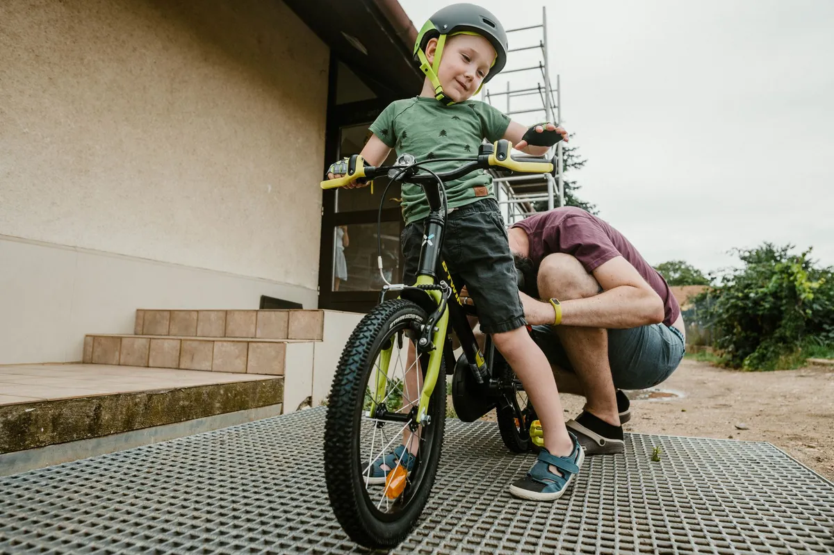 parent teaching child about e-bike safety