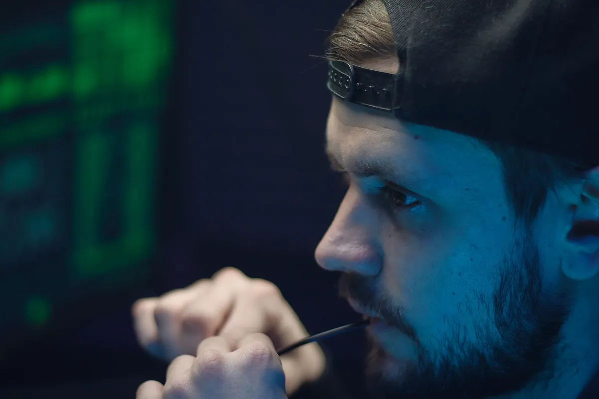 close-up of a hacker at a computer