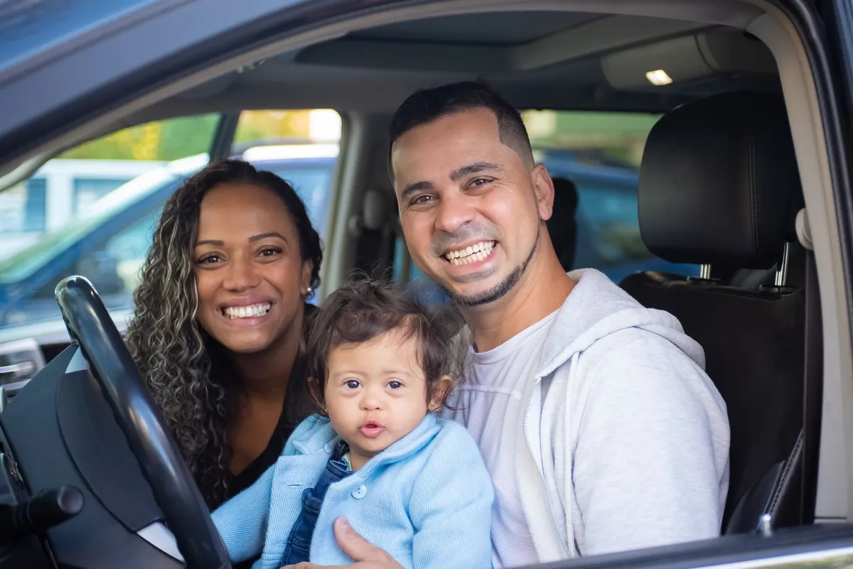 happy family driving car
