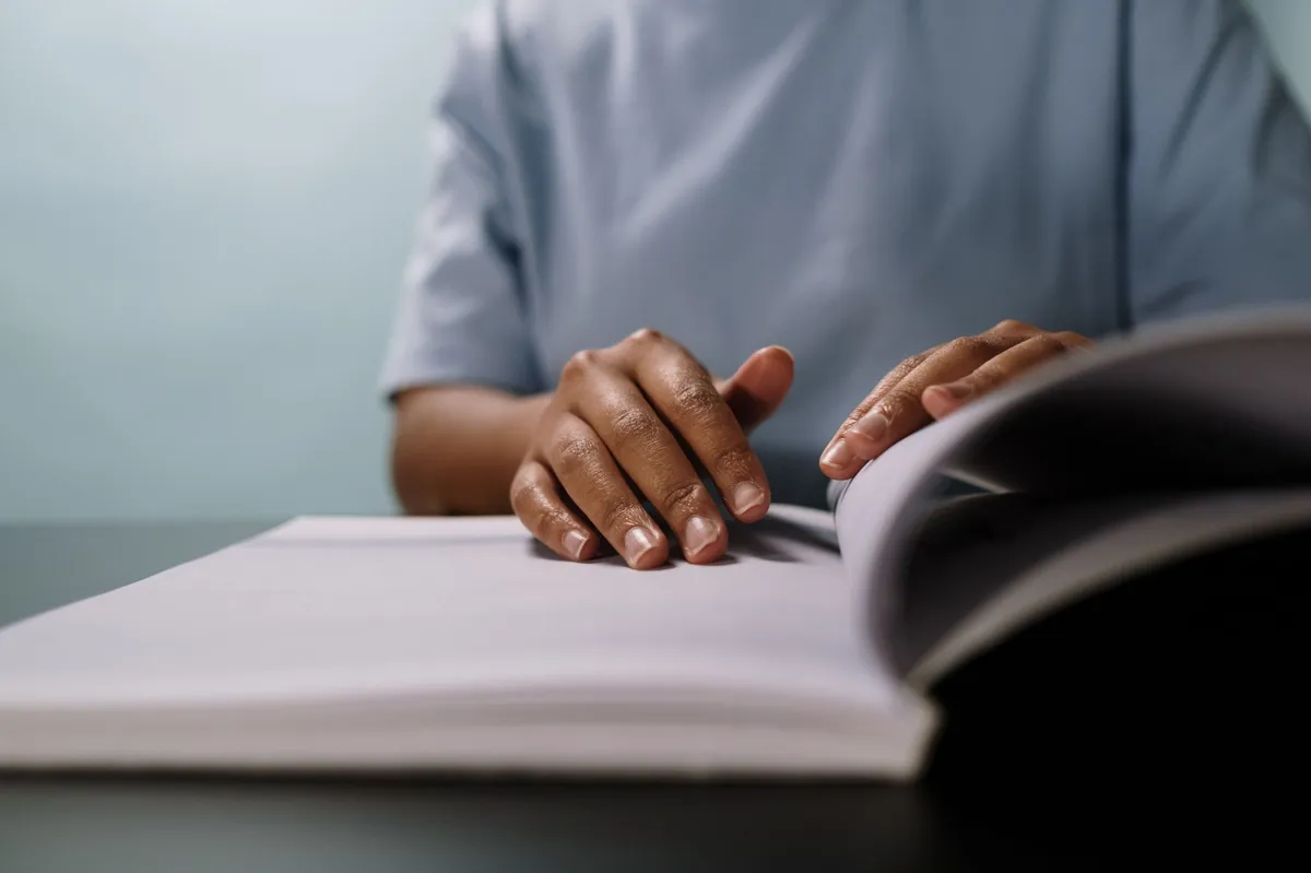 person reading car manual