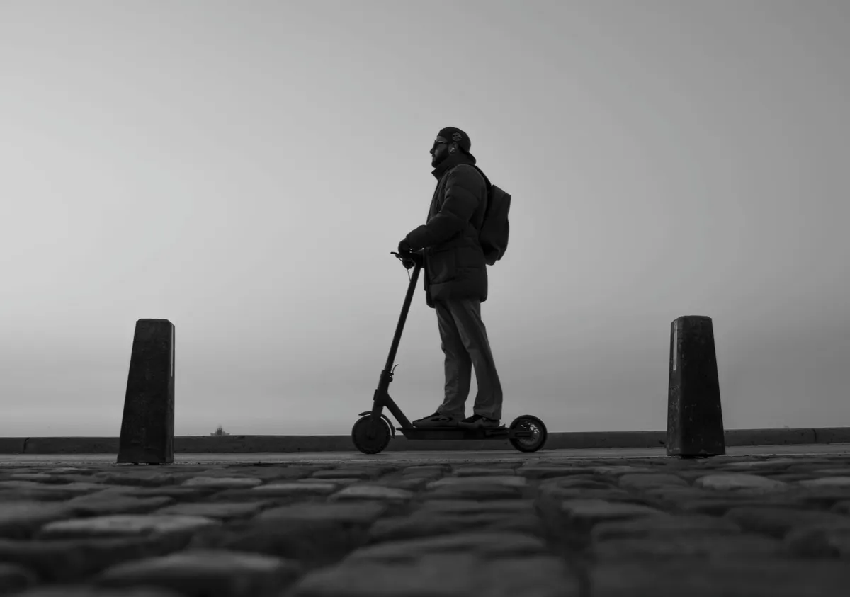 person riding illegal e-scooter