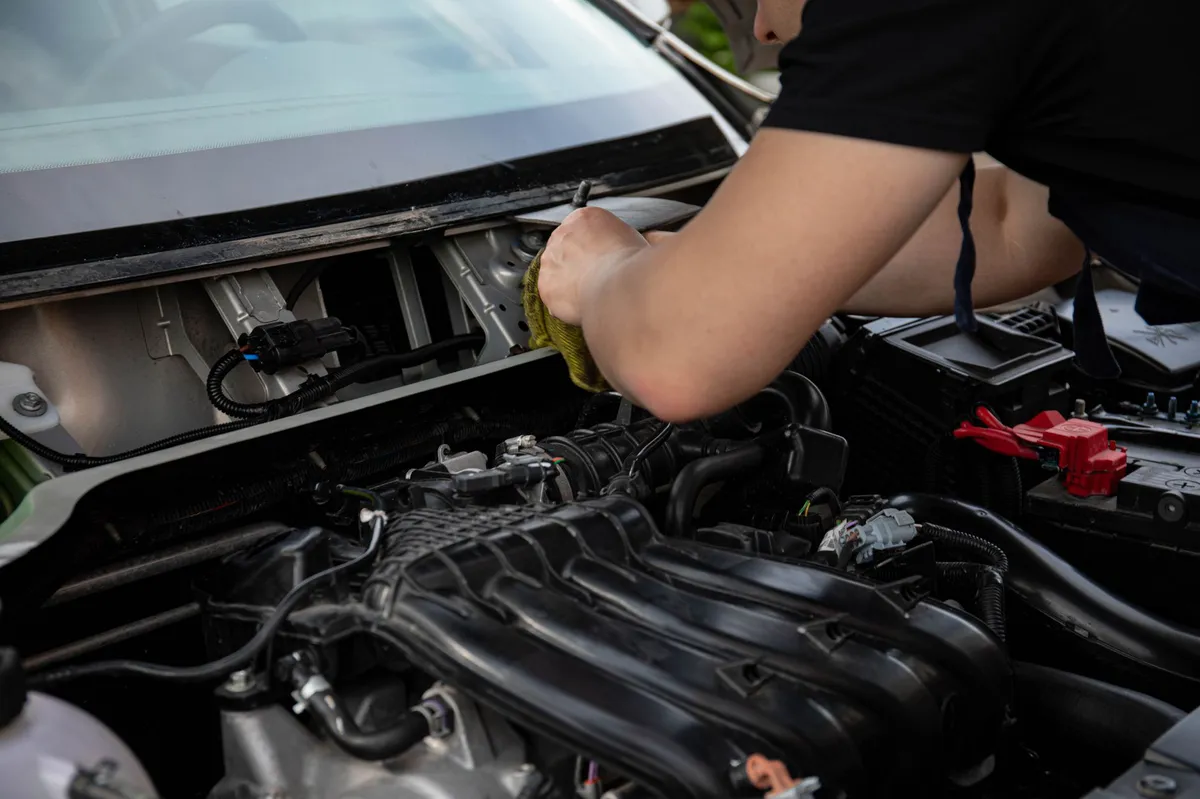 mechanic examining engine