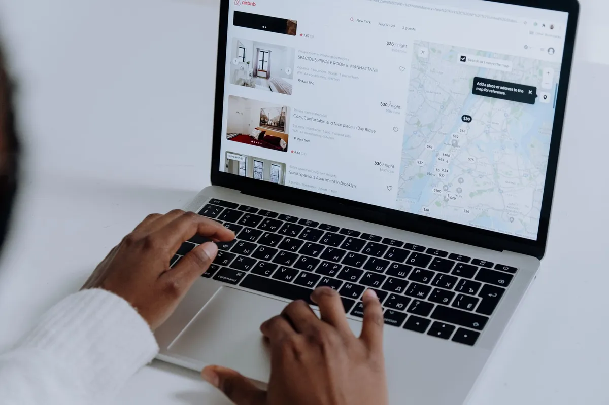 person searching for apartments online