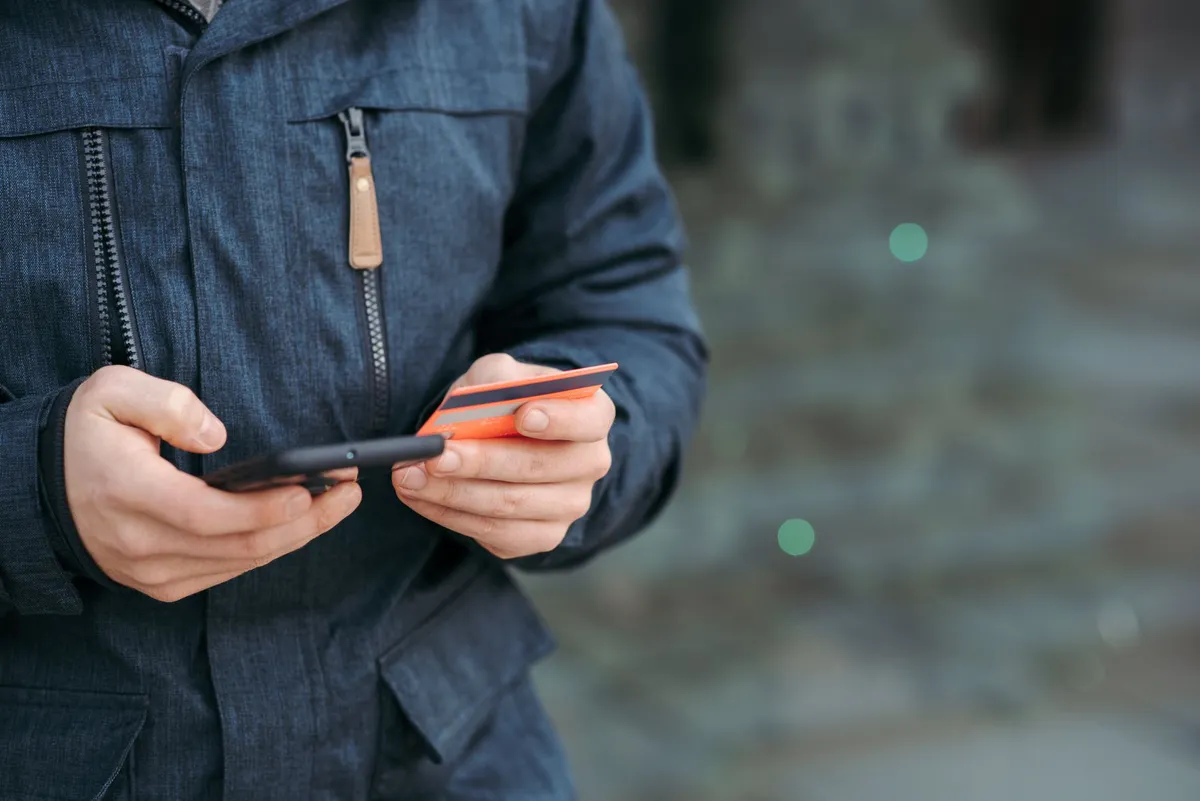 consumer using smartphone for insurance