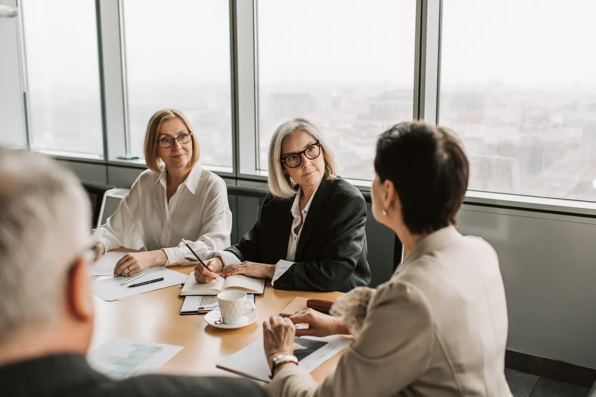 group of women discussing workplace issues