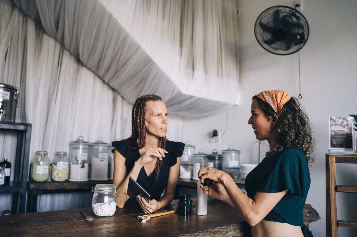 women discussing hair care products