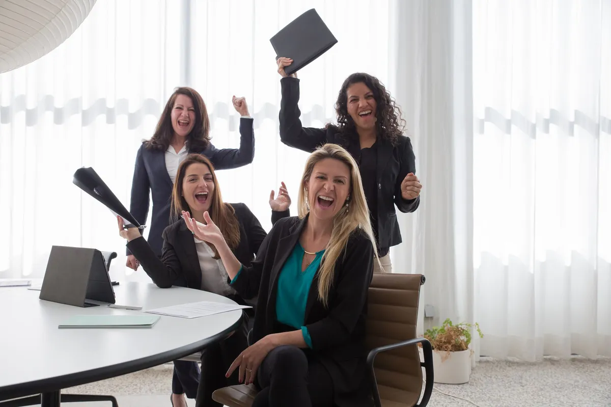 women celebrating success