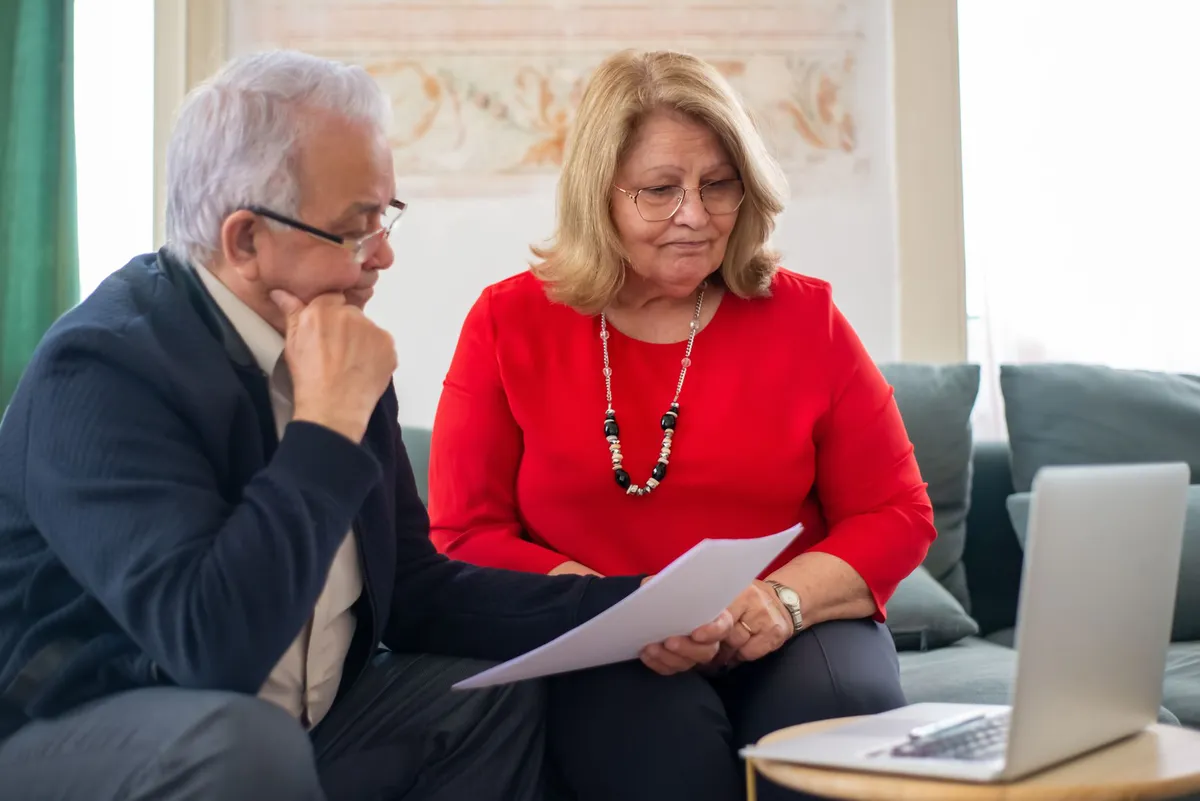 senior couple discussing insurance