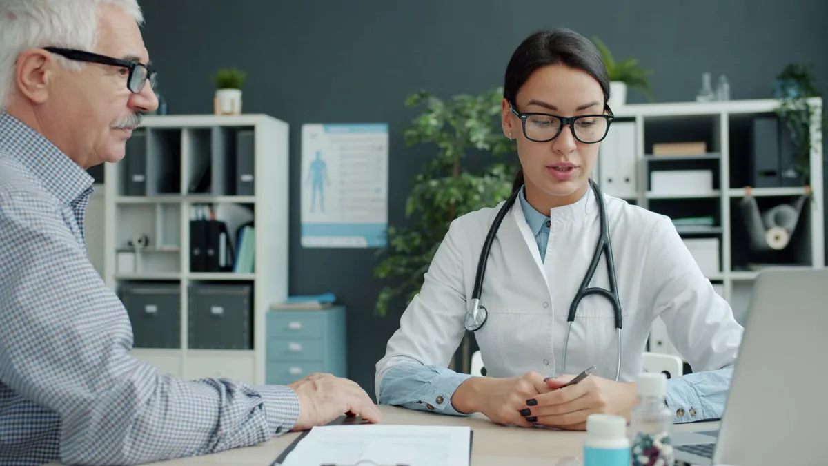 healthcare professional with elderly patient
