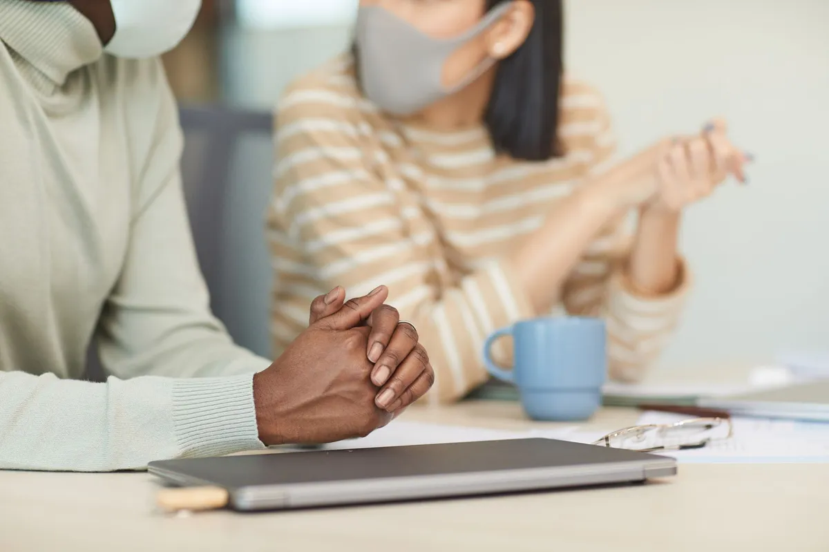 employer meeting discussing health benefits