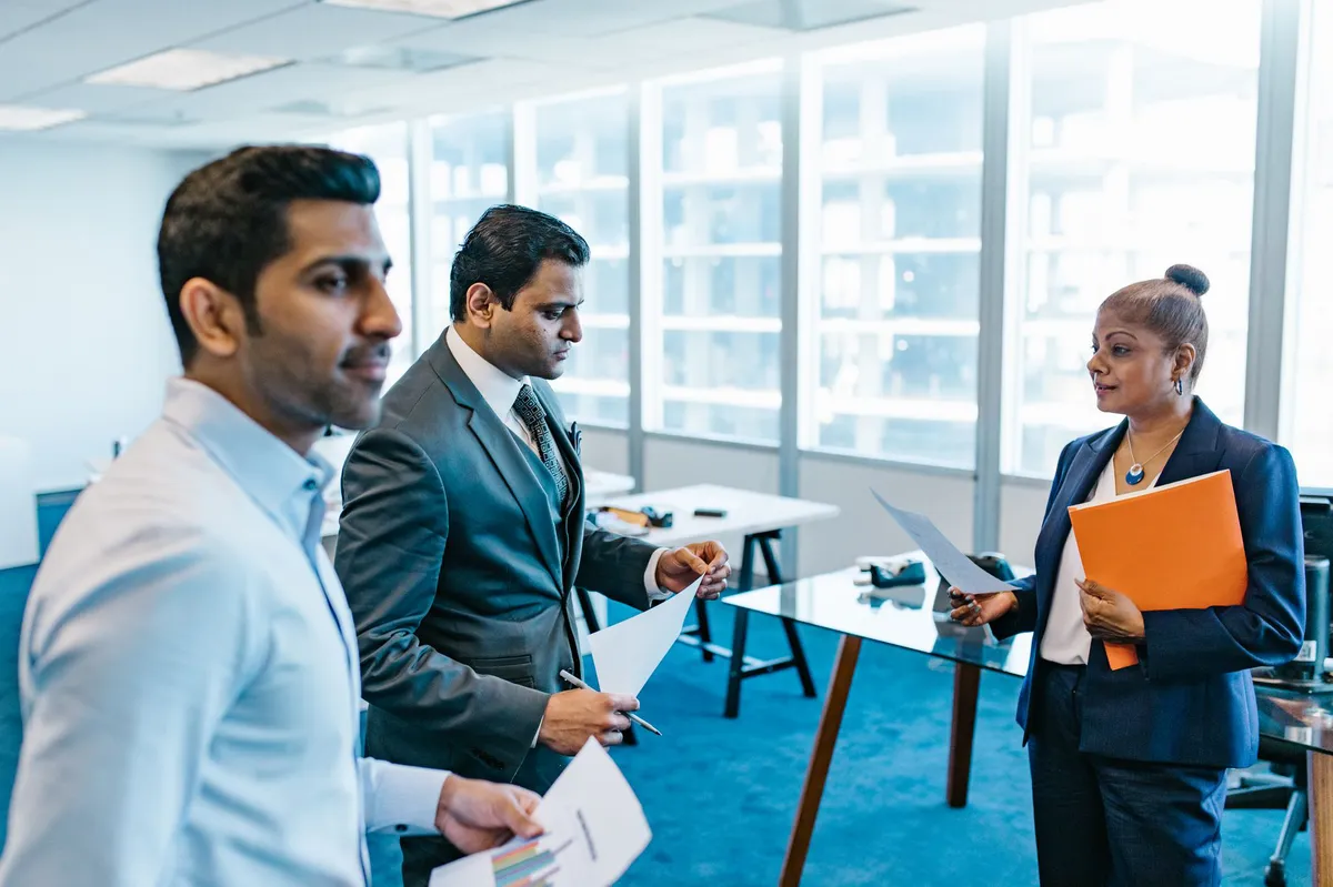 group of business professionals discussing