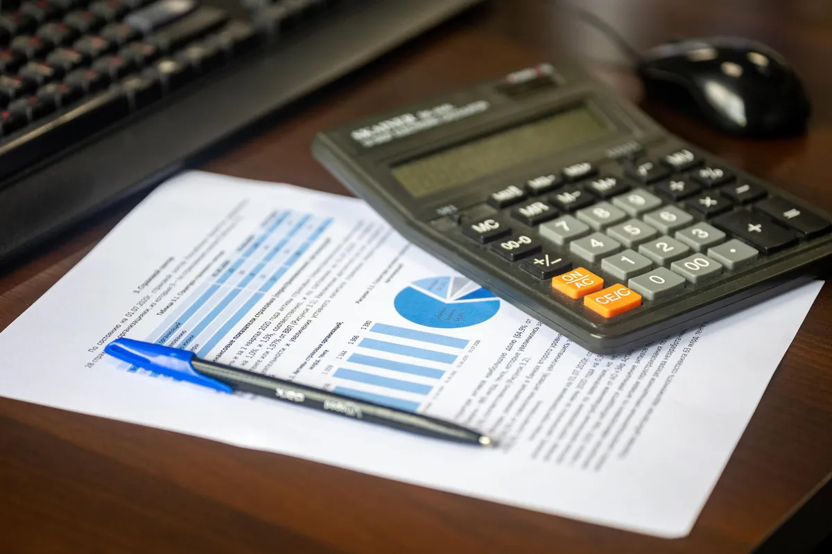 financial documents and calculator
