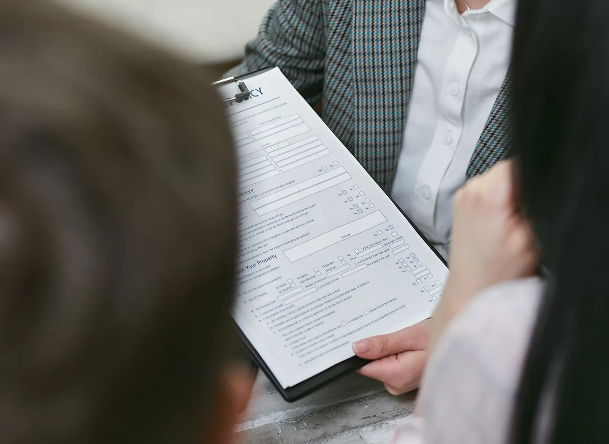 happy family reviewing insurance policy