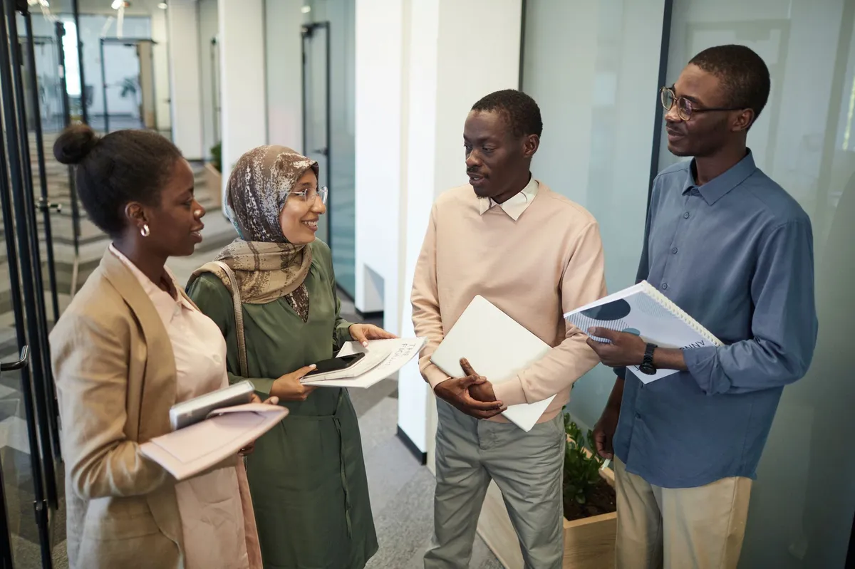 group of employees discussing benefits